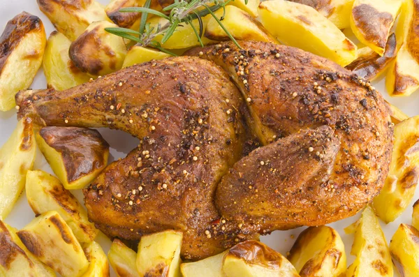 stock image Chickens roast with baking potatoes