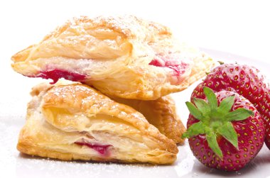 Puff pastry pockets with strawberry filling clipart