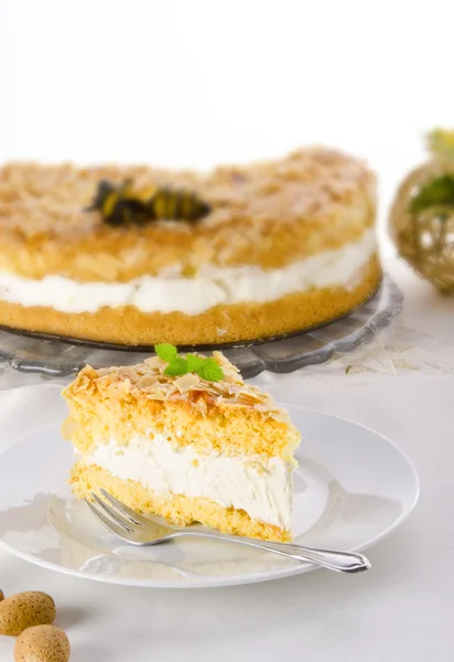Flat cake with an almond and sugar coating and a custard or cream filling — Stock Photo, Image