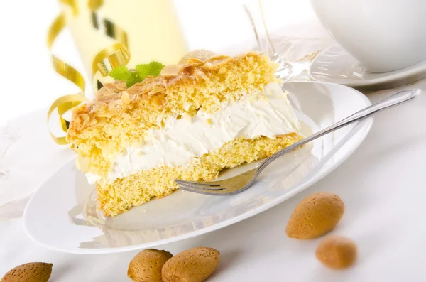 Flat cake with an almond and sugar coating — Stock Photo, Image