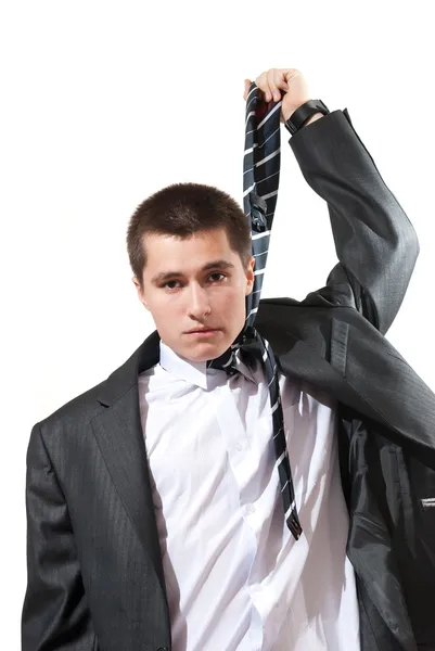 Портрет молодого бізнесмена, який виглядає в депресії від роботи, ізольованої на білому тлі — стокове фото