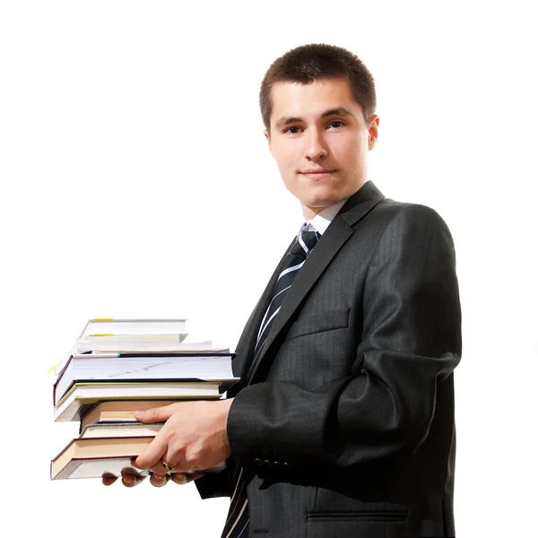 Schöner junger Geschäftsmann mit einem Stapel Bücher, isoliert — Stockfoto