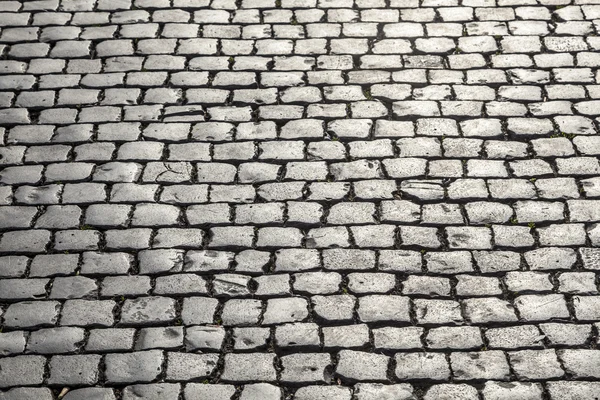 Старая мощеная каменная улица — стоковое фото