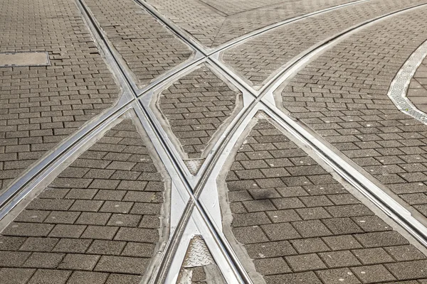 Rails of streetcar in old cobble stone street — Stock Photo, Image