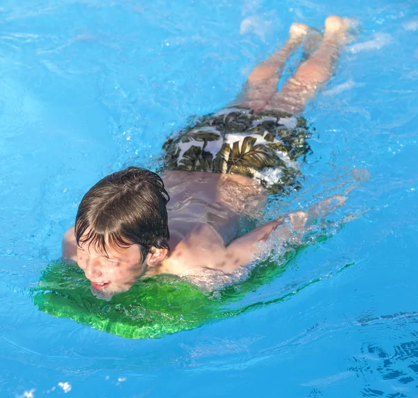 Boy surfing in the pool — Stock Photo, Image