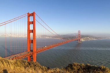 Famous San Francisco Golden Gate bridge in late afternoon light clipart