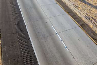 Detail of asphalt with lines of Interstate No. 8 clipart