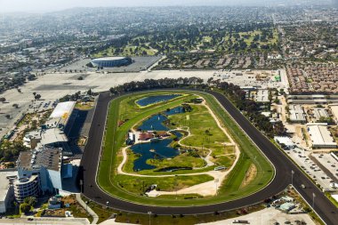 Aerial of Los Angeles and the Hollywood Park with horse race tra clipart