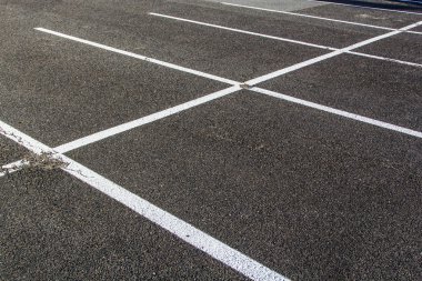 Lines for parking lotzs drawn on the asphalt clipart