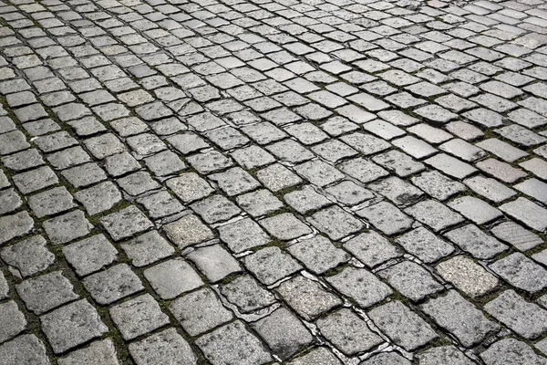 Детали булыжника каменная улица дает гармоничный узор — стоковое фото