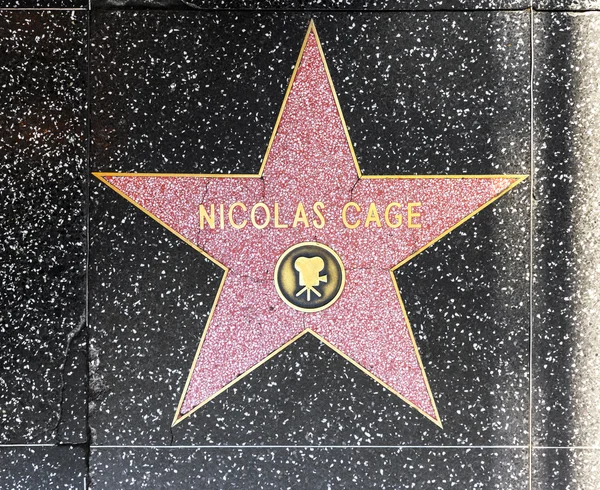 Nicolas klece hvězdu na Hollywoodském chodníku slávy — Stock fotografie