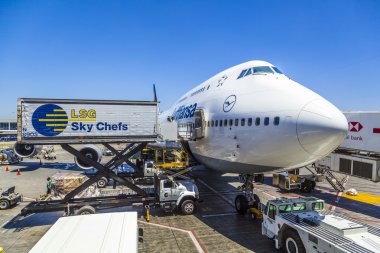 Lufthansa Boeing 747 parks at gate position clipart