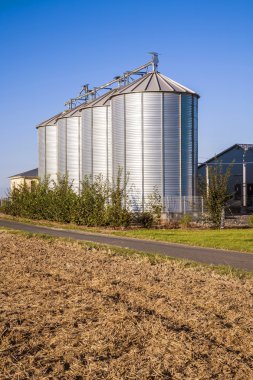 Field in harvest with silo clipart