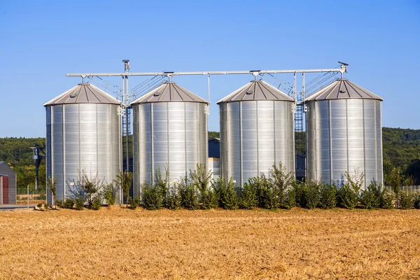 Field in harvest with silo — Stock Photo, Image