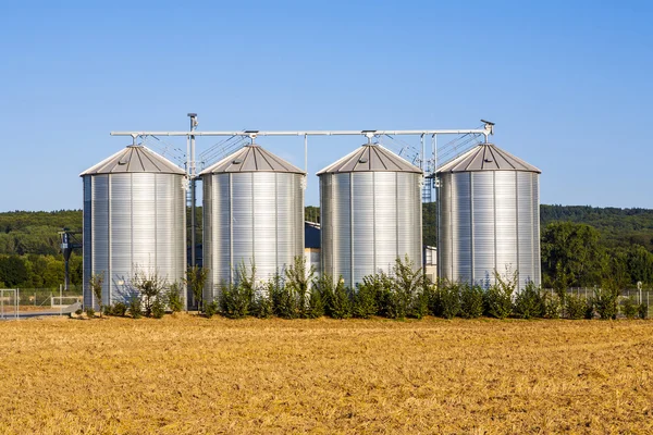 Field in harvest with silo Stock Image