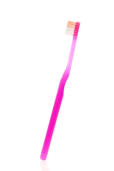 Розовая зубная щетка — стоковое фото
