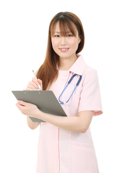 Giovane infermiera asiatica — Foto Stock