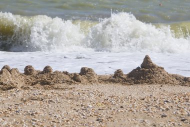 Sand castle on beach clipart