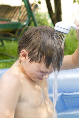 Boy in the swimming pool clipart