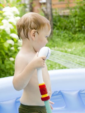 Boy in the swimming pool clipart