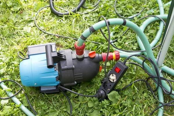 Garden hose and water pump connection — Stock Photo, Image