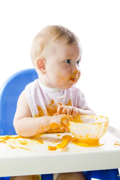 stock image A young blue-eyed child feeding pumpkin puree