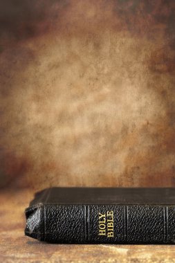 Bible with Grunge Stone Background clipart