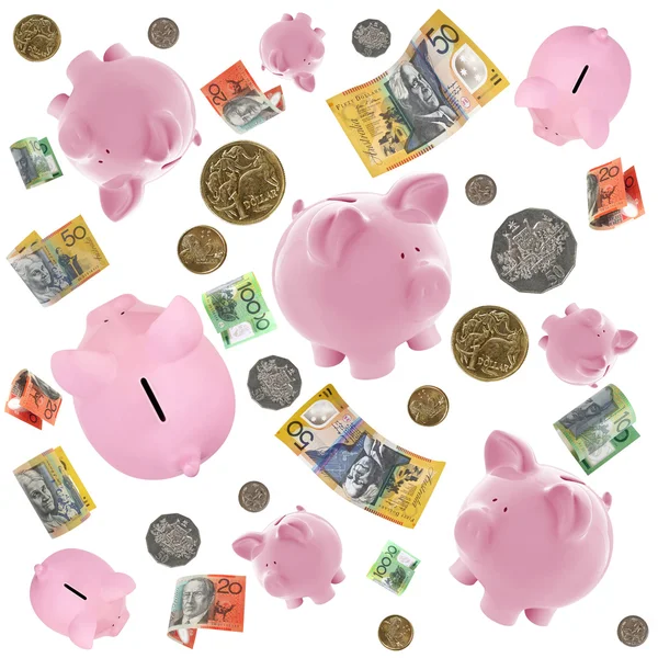 Piggy Banks and Australian Money Falling over White — Stock Photo, Image