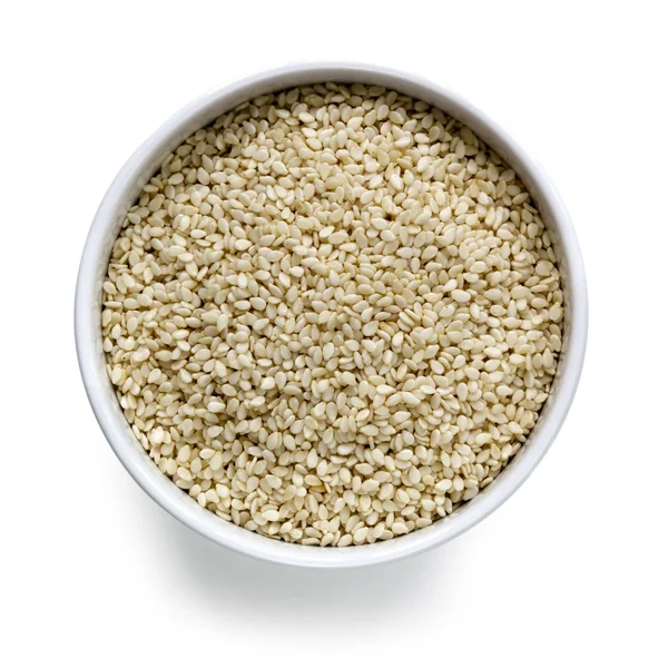 Sesame Seeds in White Bowl over White Overhead View — Stock Photo, Image