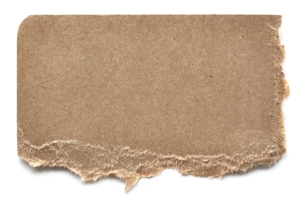 Yırtık kahverengi karton üzerine beyaz — Stok fotoğraf