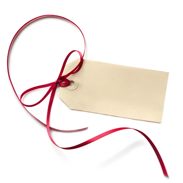 Etiqueta de regalo en blanco con cinta roja —  Fotos de Stock