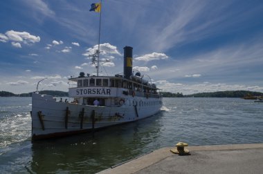 Old tourist ship Storskär approaching Vaxholm harbour clipart
