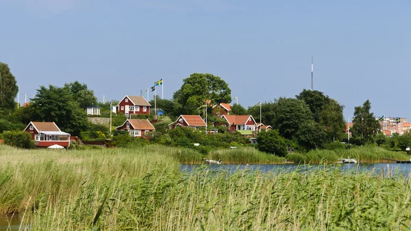 Red cottages in Brändaholm , Sweden — Stok fotoğraf