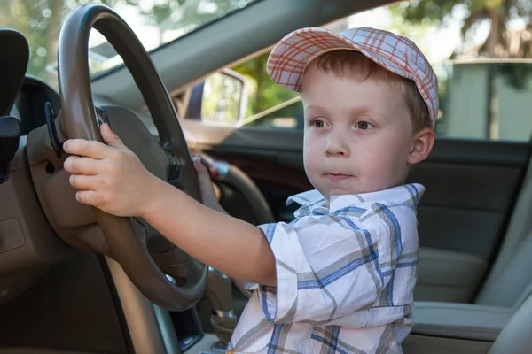Dziecko w kierownicy — Zdjęcie stockowe