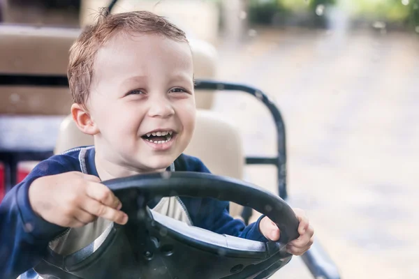 The baby at steering wheel — Stock Photo, Image