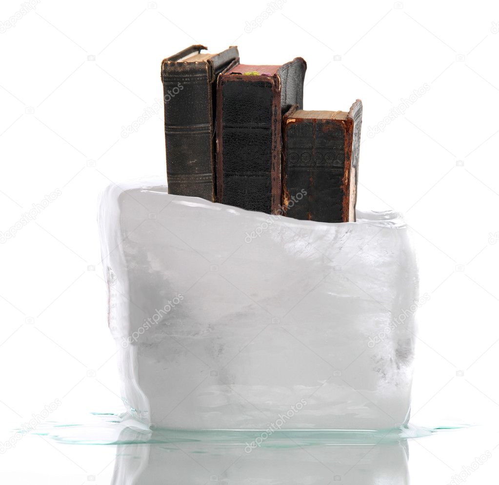 Stack of very old prayer books captured in ice