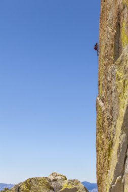 Climber gripping the rock. clipart