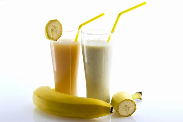Banana cocktail and banana juice with a straw and fresh banana — Stock Photo, Image
