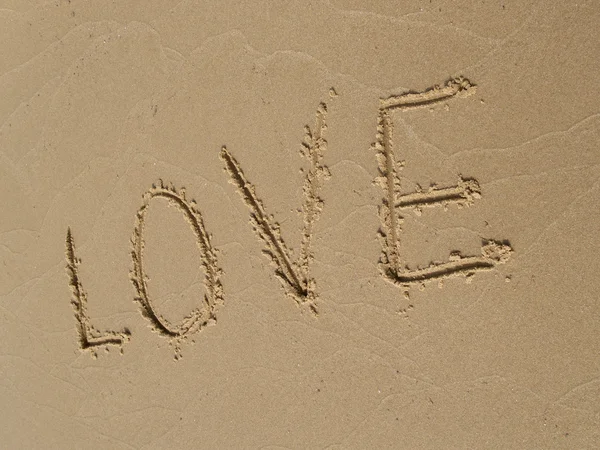 LOVE inscription on a sandy beach — Stock Photo, Image