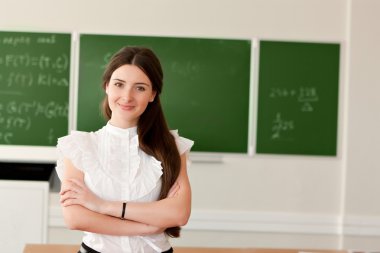Teacher on background of blackboard clipart