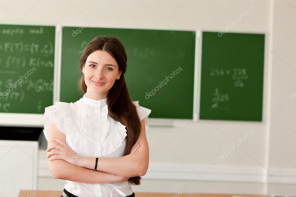 Teacher on background of blackboard Stock Photo by ©nigerfoxy 10916856