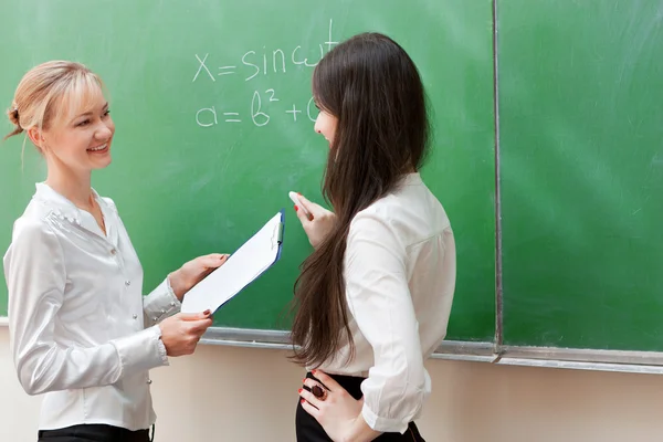 Two teachers discuss formula Stock Picture