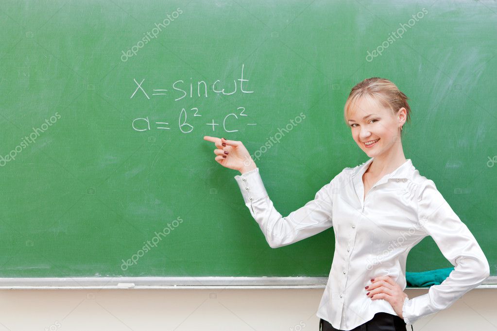 Teacher shows on blackboard Stock Photo by ©nigerfoxy 11138668