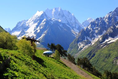 UFO in Caucasus mountains Dombai clipart