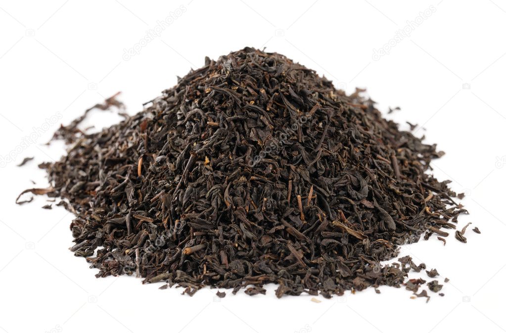 Earl Grey black loose tea leaves on white background, shallow d