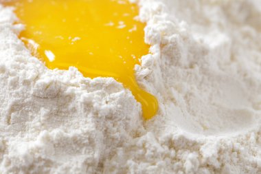 Bake it! egg yolk on white flour clipart