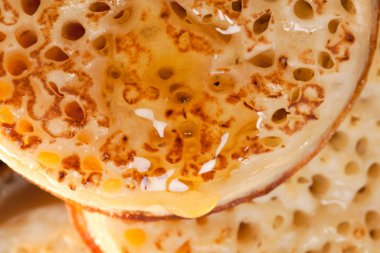 British toasted crumpet with honey clipart