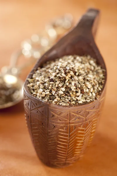 Zaatar- a blend of herbs, sesame seeds and salt in a wooden bow — Stock Photo, Image