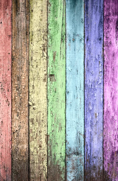 Aged rainbow painted wooden fence, naturally weathered — Stock Photo, Image