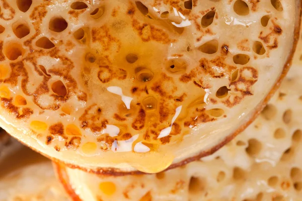 stock image British toasted crumpet with honey